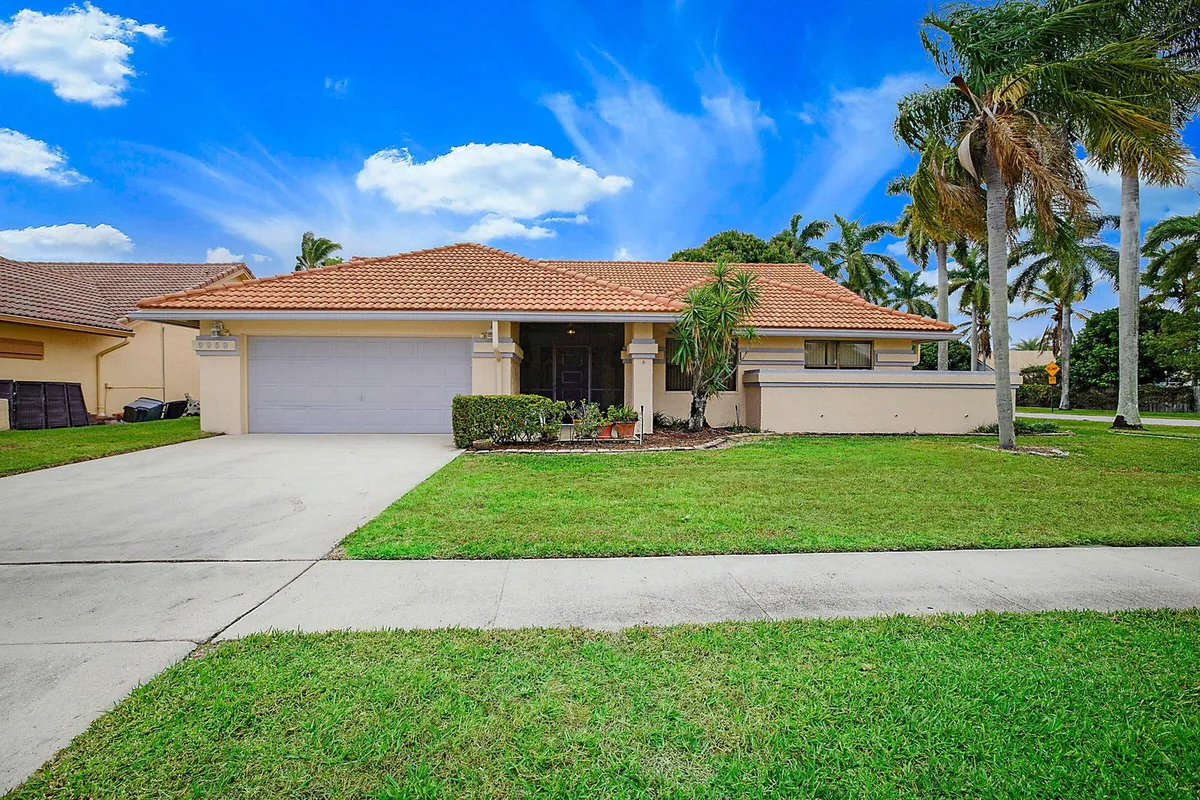 Street view of a single-story South Florida home photographed for a PBP Real Estate listing.