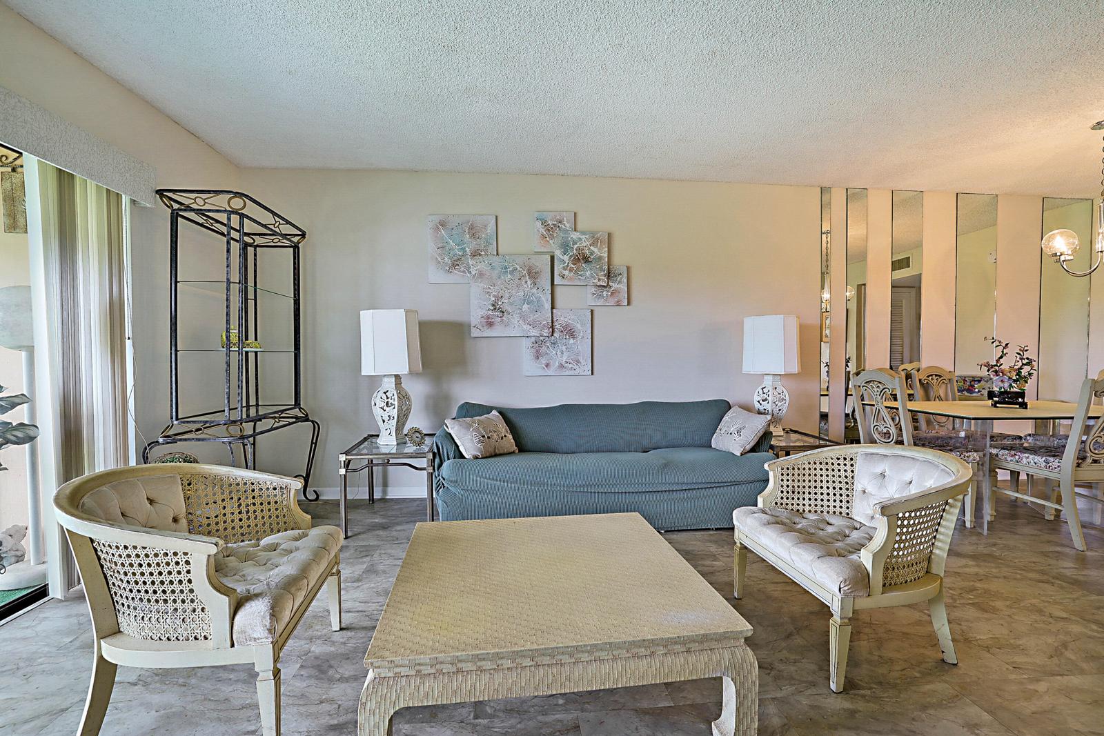 76 Capri B, Delray Beach, FL 33484 - living room with sliding doors to the balcony