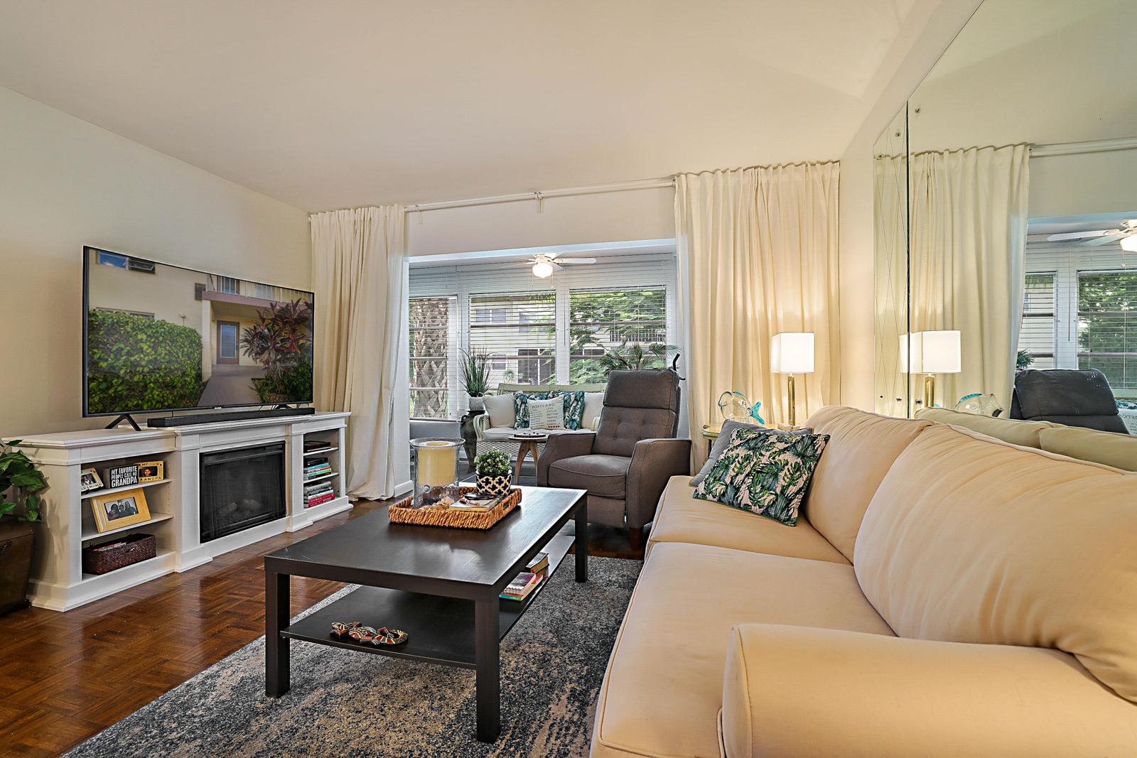 441 NW 76th Avenue #101, Margate, FL 33063 - living room opening to the enclosed patio