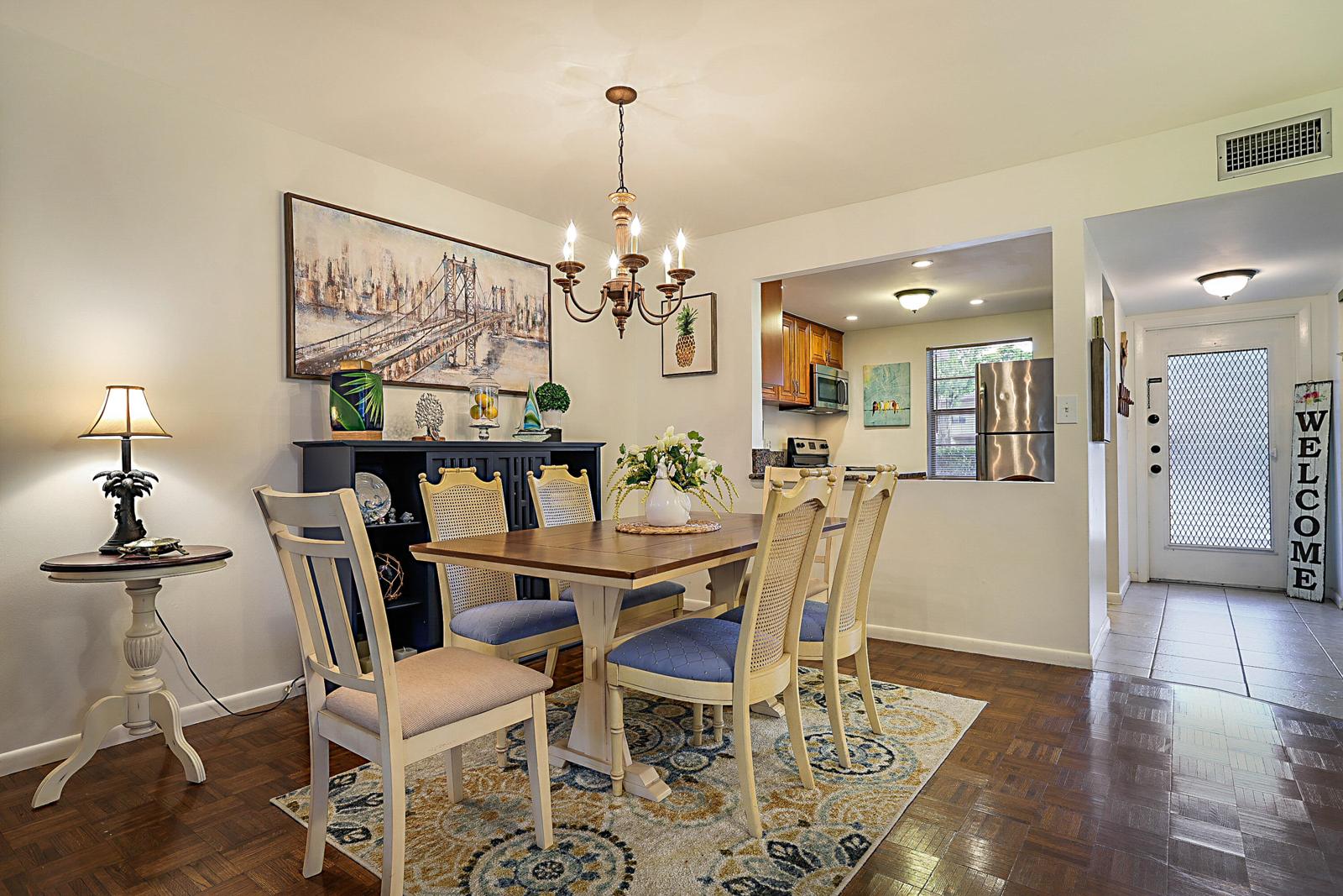 441 NW 76th Avenue #101, Margate, FL 33063 - dining area with chandelier