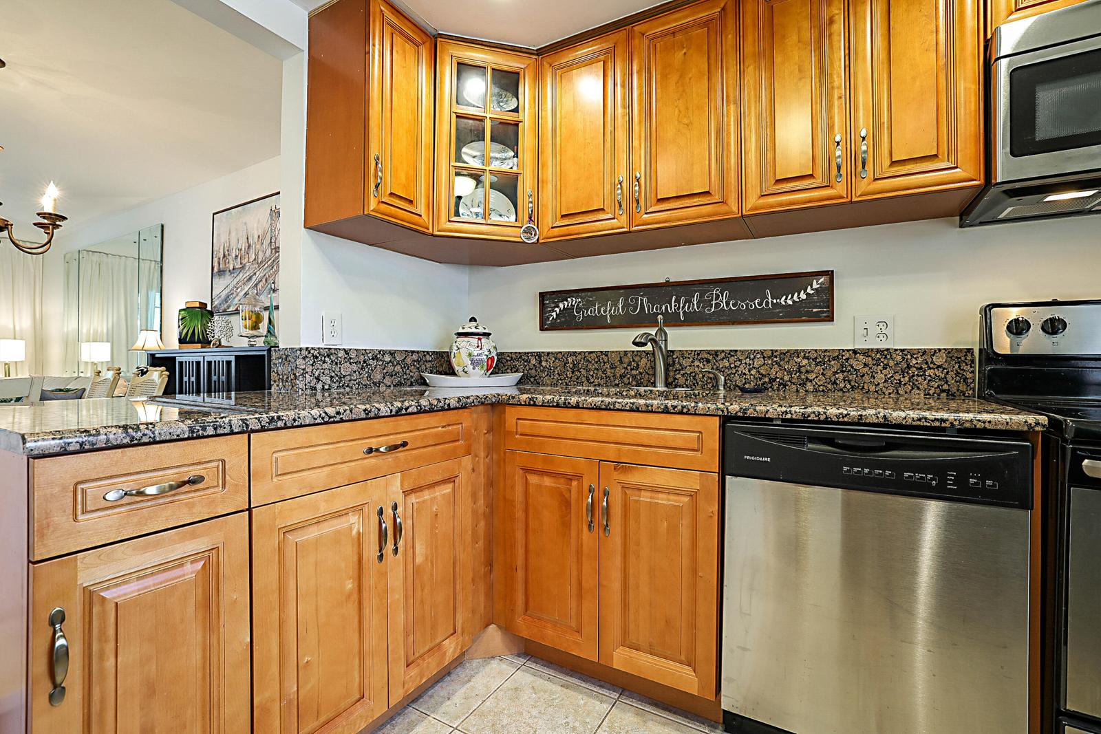 441 NW 76th Avenue #101, Margate, FL 33063 - updated kitchen with wood cabinets and granite countertops