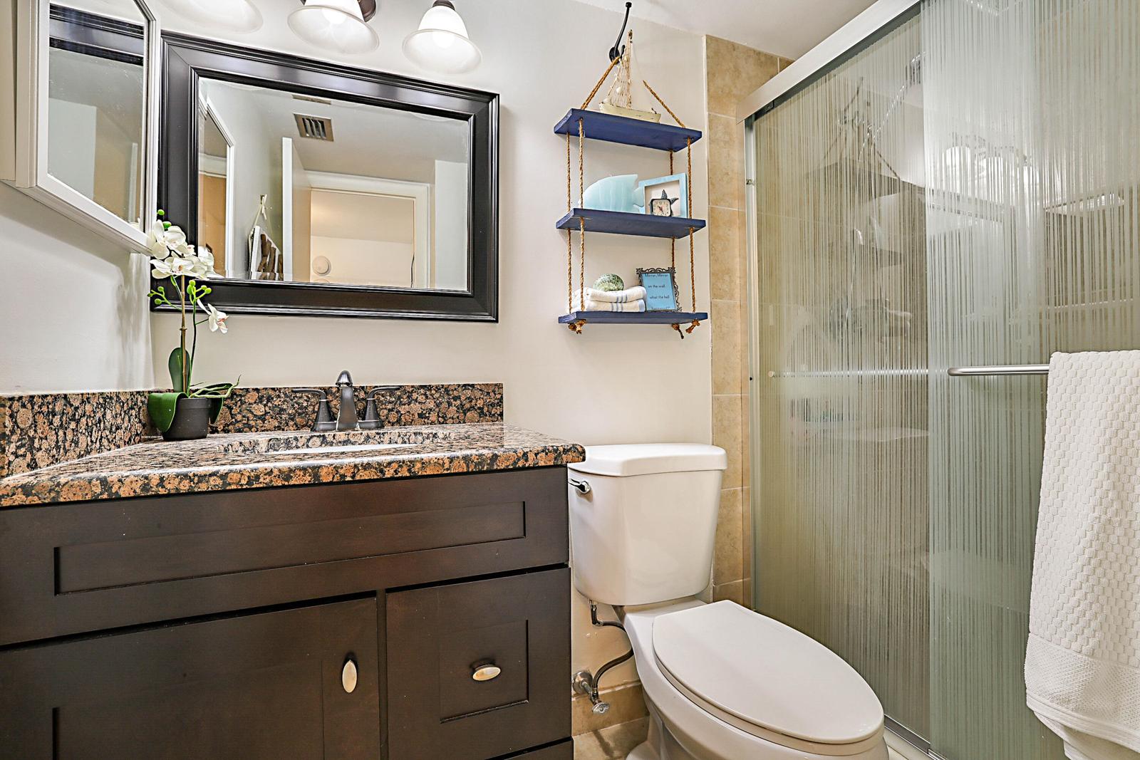 441 NW 76th Avenue #101, Margate, FL 33063 - remodeled bathroom with glass shower